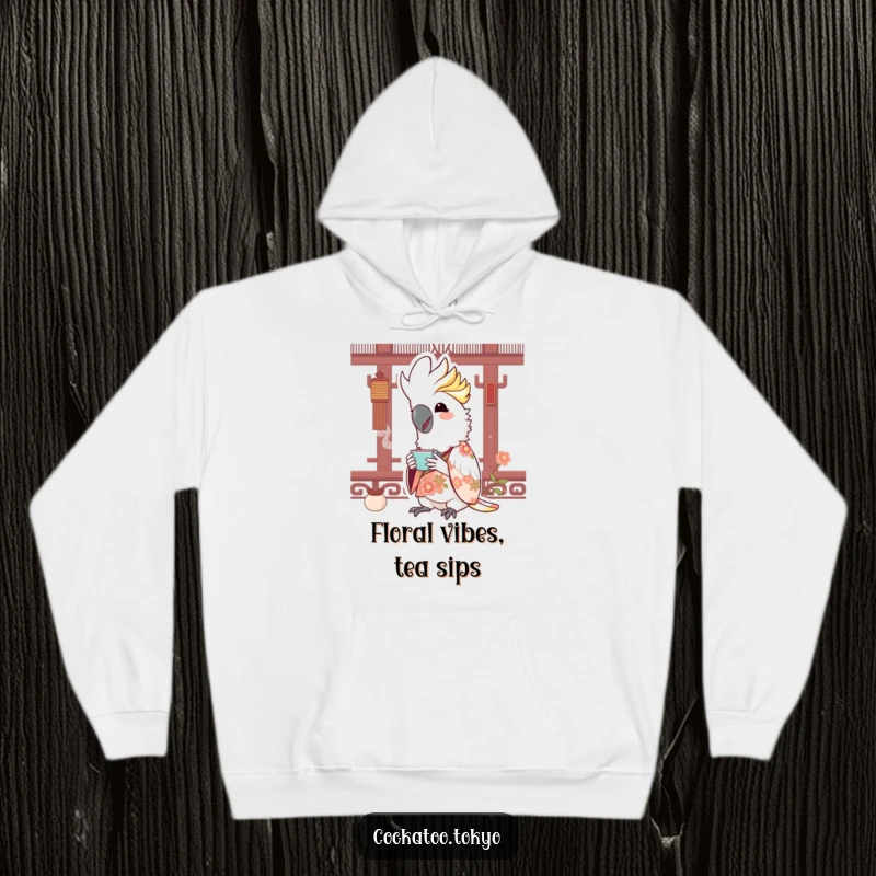 Funny Kawaii Cockatoo Hoodie: Bird in floral kimono sips tea, offering cozy comfort and cheerful humor.